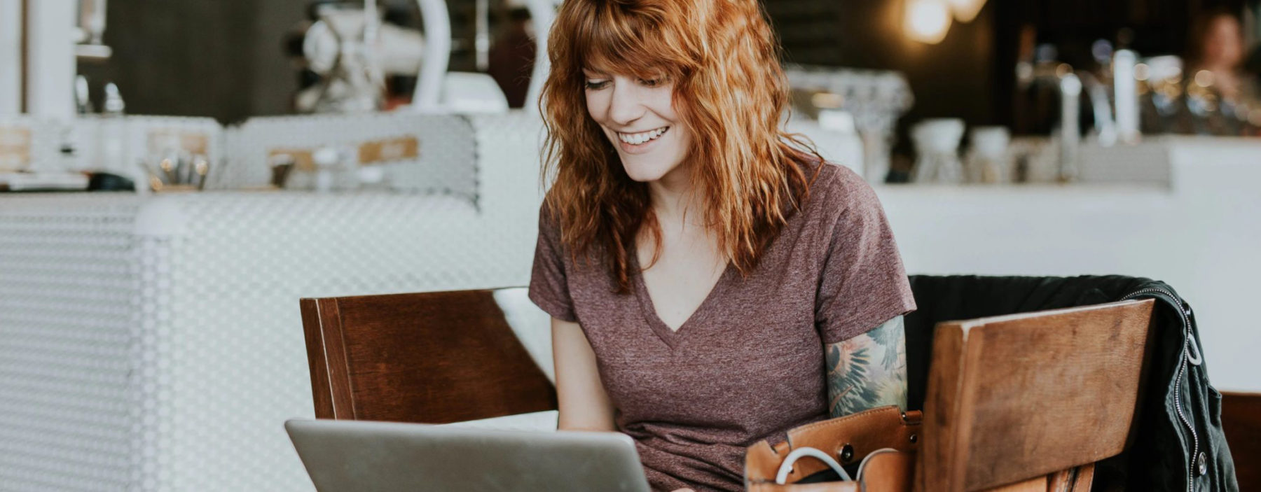 Woman viewing social media on her laptop